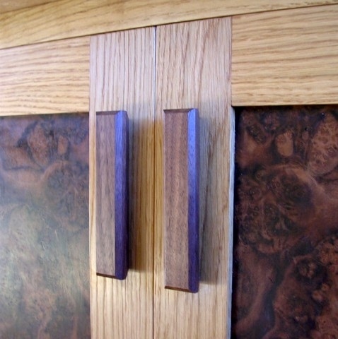 Walnut handles on an oak and walnut sideboard