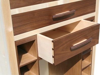 A wine and Cutlery cabinet in sycamore and american walnut drawer detail