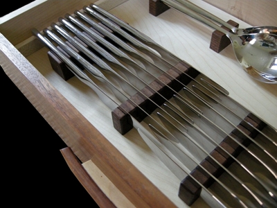 Internal view of knife drawer in a wine and Cutlery cabinet in sycamore and american walnut