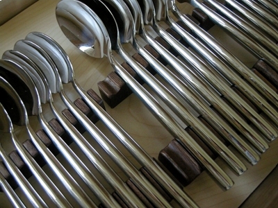Internal view of spoon drawer in a wine and Cutlery cabinet in sycamore and american walnut